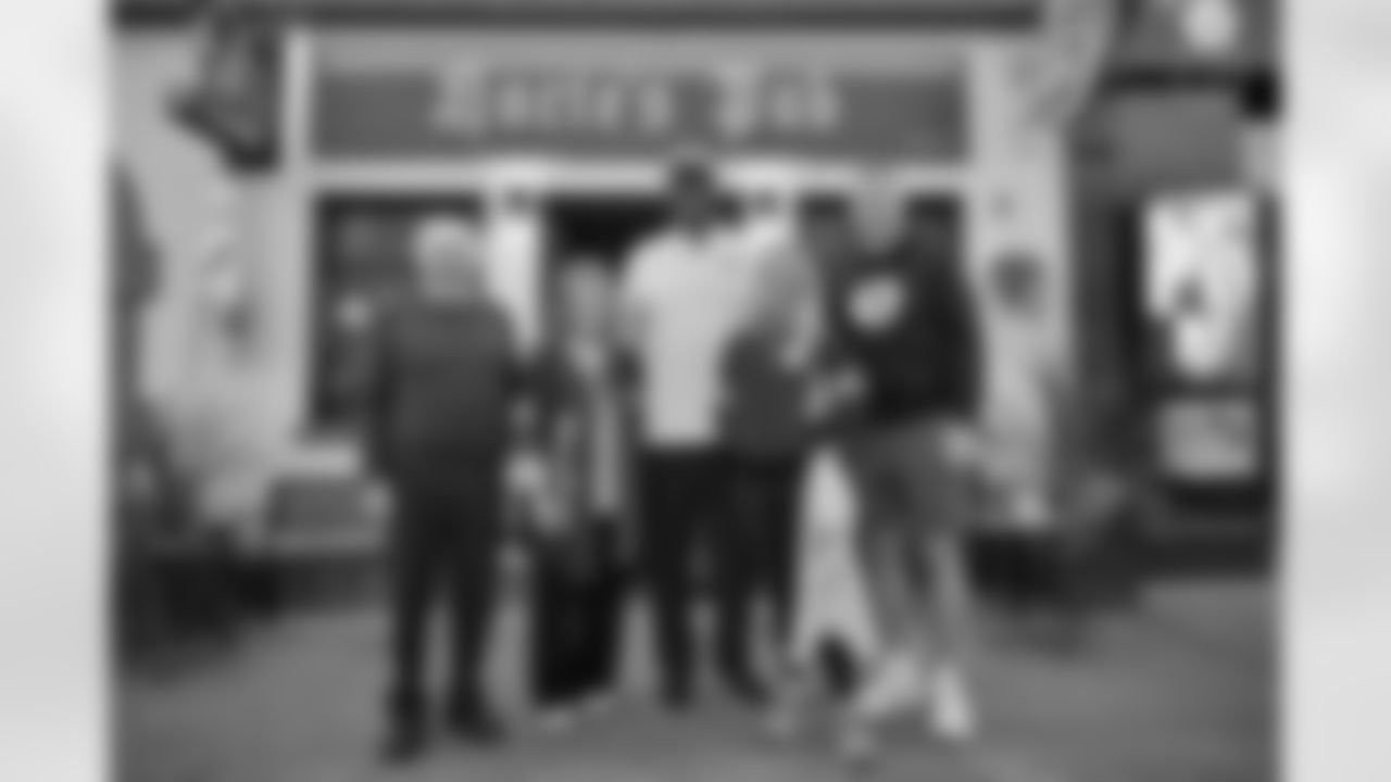 Pittsburgh Steelers legend Max Starks gives out Terrible Towels to locals on Tuesday, Sept. 23, 2025 in Gort, Ireland. (Brendan Moran / Pittsburgh Steelers)