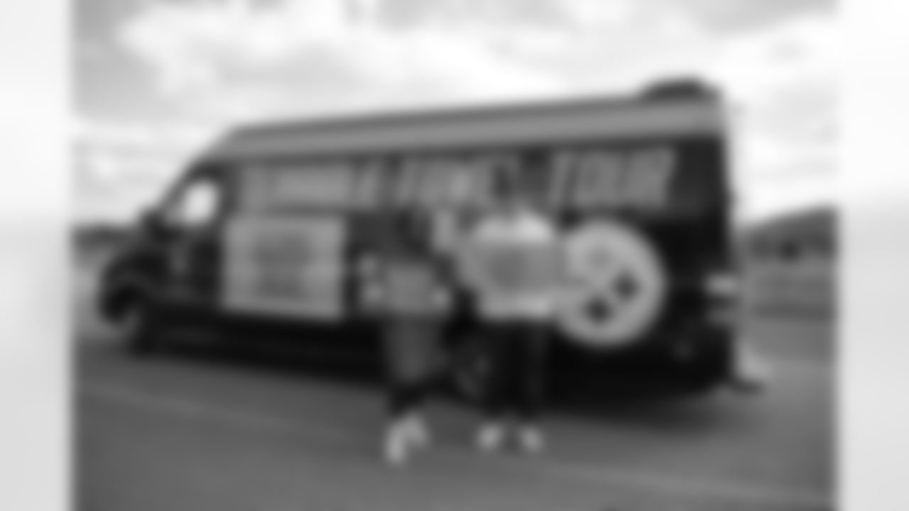 Pittsburgh Steelers legend Max Starks gives out Terrible Towels to locals at the Cliffs of Moher on Tuesday, Sept. 23, 2025 in County Clare, Ireland. (Brendan Moran / Pittsburgh Steelers)