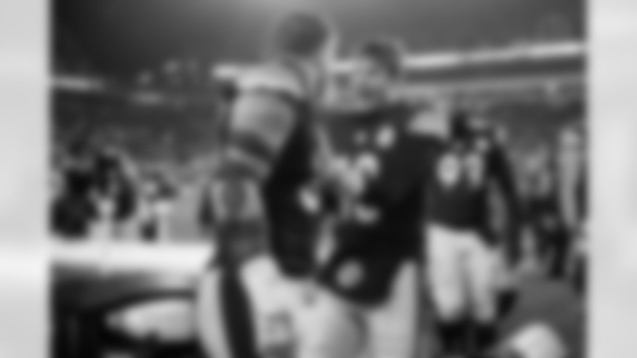 Pittsburgh Steelers linebacker Jack Sawyer (33) and Pittsburgh Steelers quarterback Will Howard (18) celebrate following a regular season game against the Baltimore Ravens, Sunday, Jan. 4, 2026 in Pittsburgh, PA. The Steelers defeated the Ravens 26-24. (Alysa Rubin / Pittsburgh Steelers)