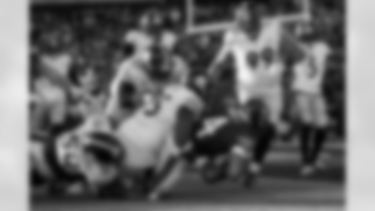 Pittsburgh Steelers defensive tackle Keeanu Benton (95) and Pittsburgh Steelers defensive tackle Cameron Heyward (97) tackle an opponent during a regular season game against the Chicago Bears, Sunday, Nov. 23, 2025 in Chicago, IL. The Bears beat the Steelers 31-28. (Alysa Rubin / Pittsburgh Steelers)