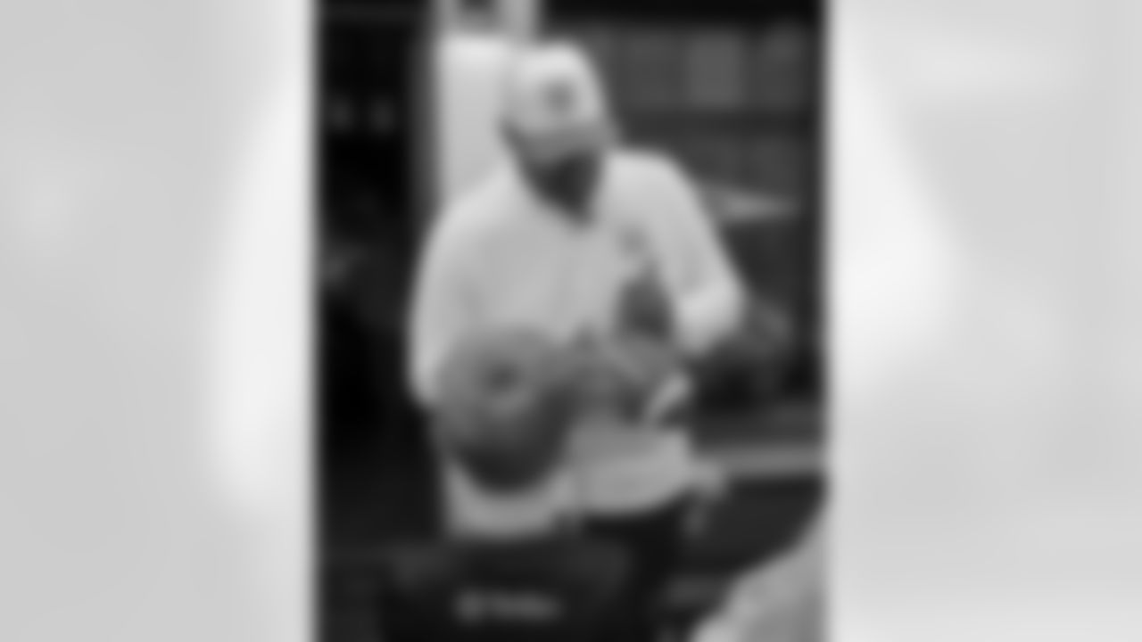 Pittsburgh Steelers legend Max Starks gives out Terrible Towels to locals on Tuesday, Sept. 23, 2025 in Gort, Ireland. (Brendan Moran / Pittsburgh Steelers)