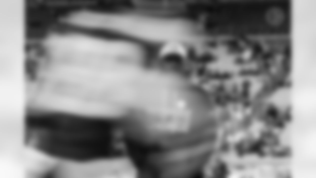 Pittsburgh Steelers head coach Mike Tomlin prior to a regular season game between the Pittsburgh Steelers and the Miami Dolphins, Monday, Dec. 15, 2025 in Pittsburgh, PA. The Steelers defeated the Dolphins 28-15. Coach would often stand off to the side, watching the linebackers go through their pregame warmups. The drills were standard, but I wanted to capture the motion of the players running in the foreground while keeping Coach in focus. The key was making sure I stood still enough to keep Coach sharp, while still allowing for that nice motion blur. (Taylor Ollason / Pittsburgh Steelers)
Model: Nikon Z8 Lens(mm):145 ISO: 800 Aperture: 18 Shutter: 1/15