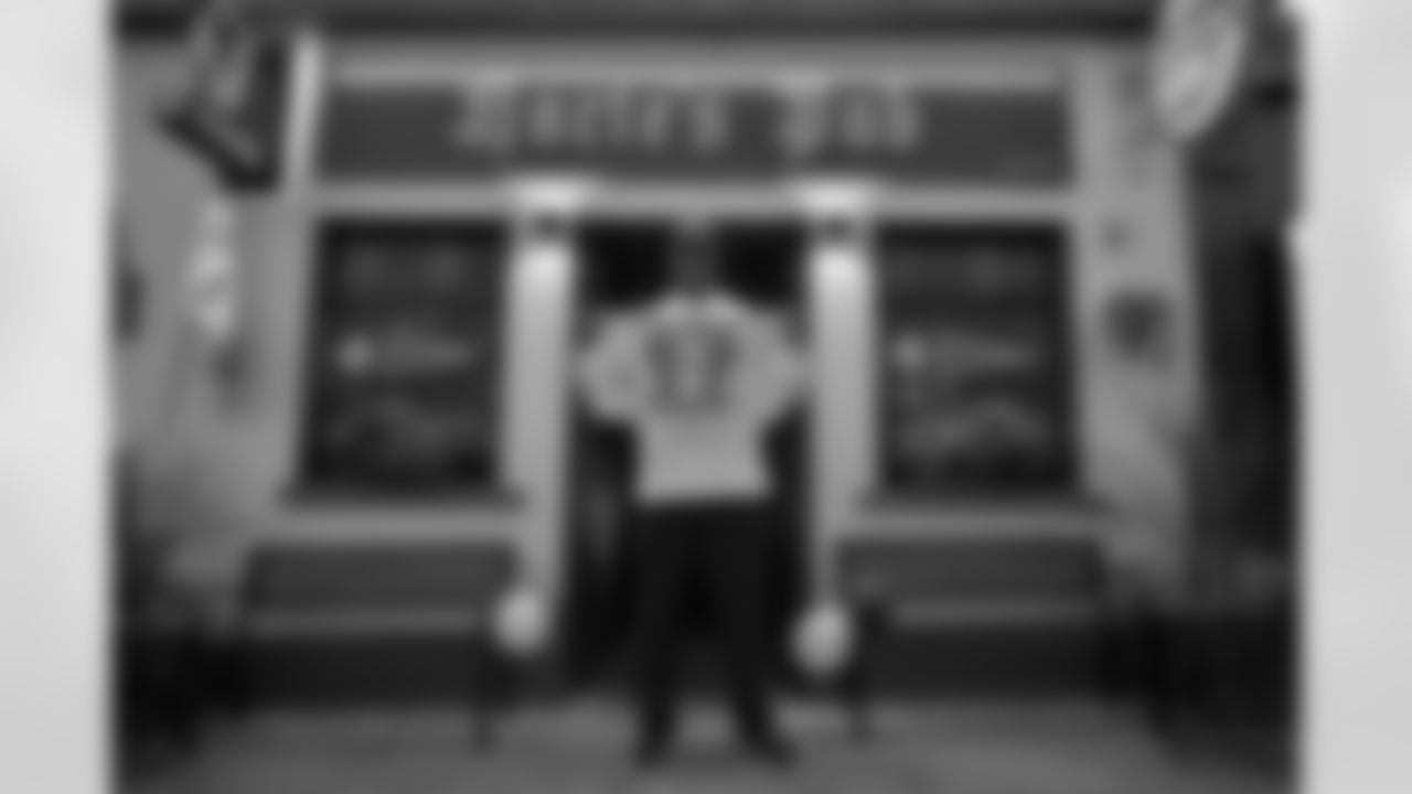 Pittsburgh Steelers legend Max Starks gives out Terrible Towels to locals on Tuesday, Sept. 23, 2025 in Gort, Ireland. (Brendan Moran / Pittsburgh Steelers)