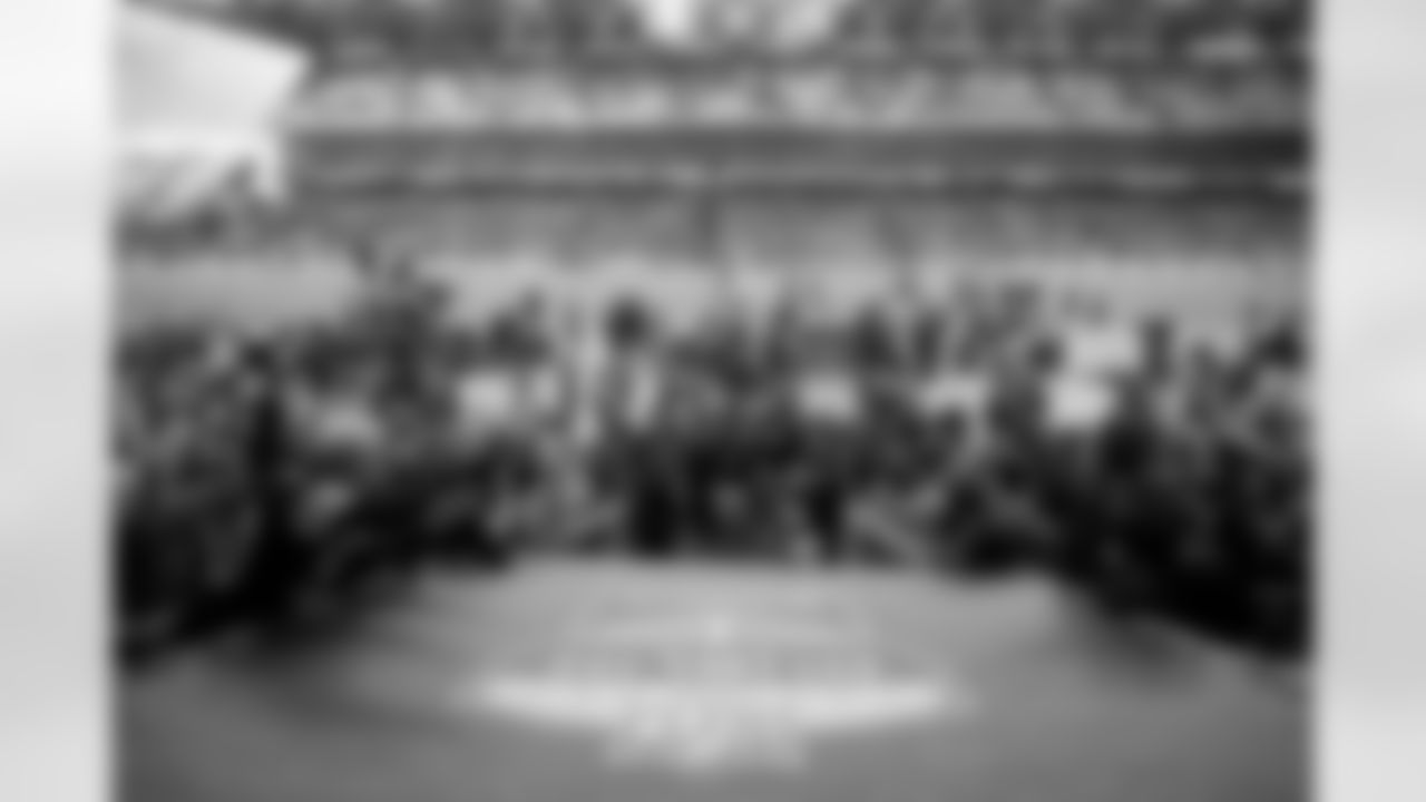 Pittsburgh Steelers quarterback Aaron Rodgers (8), Pittsburgh Steelers head coach Mike Tomlin and Pittsburgh Steelers defensive tackle Cameron Heyward (97) acknowledge the crowd following a regular season game against the Minnesota Vikings, Sunday, Sept. 28, 2025 in Dublin, Ireland. The Steelers defeated the Vikings 24-21.  After each win, Coach T, Rodgers and Heyward walked off of the field together, often waving and interacting with the crowd. I usually capture this moment from field level, but before the game, I scouted this location, knowing that if we were to win, the reaction from Coach, Rodgers, Heyward and the fans would make for a great image. After I finished capturing post game scenes at field level, I sprinted up the stairs to this spot above our tunnel. I used a 24-70mm lens to show the complete scene, including the Dublin game crest, Ireland flag, and the sea of fans. (Alysa Rubin/ Pittsburgh Steelers)

Model: Nikon Z9
Lens (mm): 26
ISO 1000
Aperture: 3.2
Shutter: 1/2000