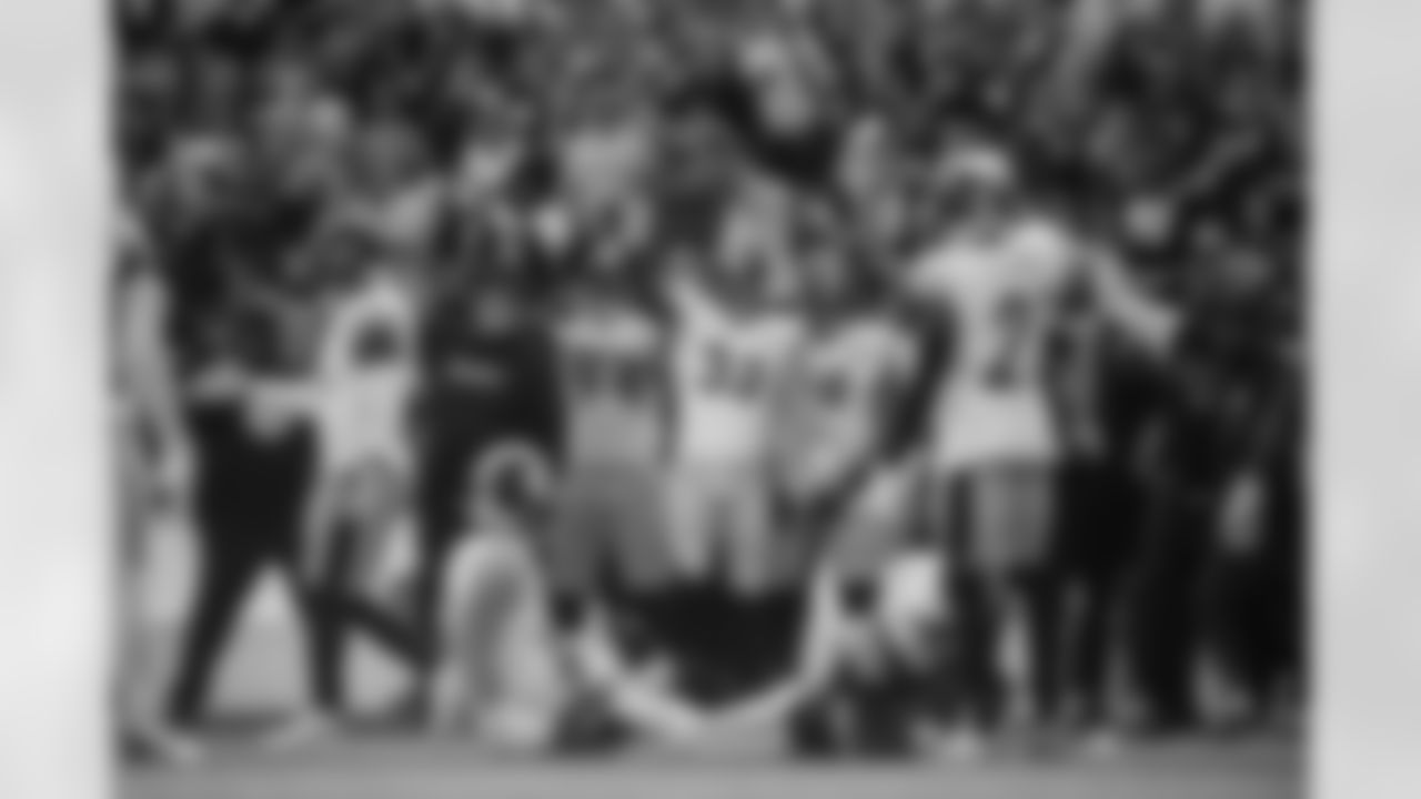 Pittsburgh Steelers defensive line coach Karl Dunbar,  outside linebacker coach Denzel Martin, defensive end Yahya Black (94),  linebacker Jack Sawyer (33),  defensive tackle Derrick Harmon (99),  linebacker Patrick Queen (6),  defensive back Chuck Clark (21) and  head coach Mike Tomlin celebrate a crucial play during a regular season game against the New England Patriots, Sunday, Sept. 21, 2025 in Foxborough, MA. The Steelers defeated the Patriots 21-14. (Alysa Rubin / Pittsburgh Steelers)