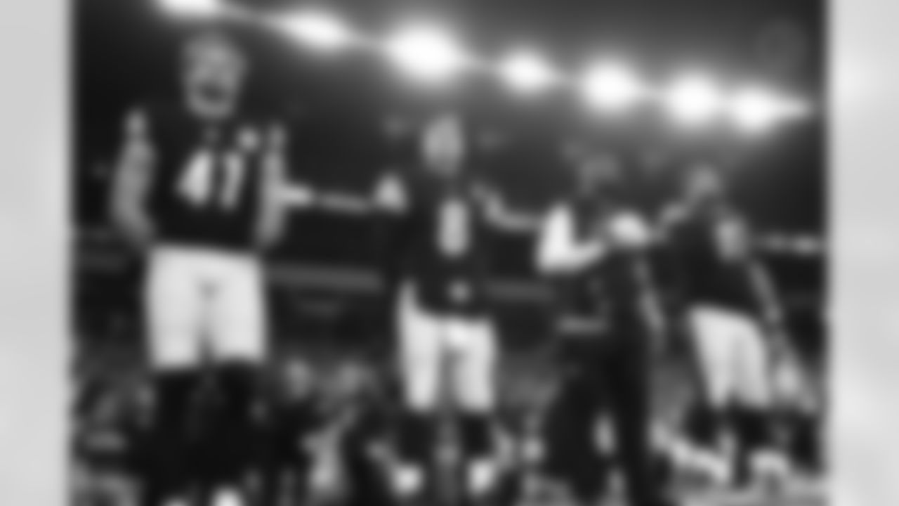 Pittsburgh Steelers linebacker Payton Wilson (41), Pittsburgh Steelers quarterback Aaron Rodgers (8), Pittsburgh Steelers head coach Mike Tomlin and Pittsburgh Steelers defensive tackle Cameron Heyward (97) during a postseason Wild Card game between the Pittsburgh Steelers and the Houston Texans, Monday, Jan. 12, 2026 in Pittsburgh, PA. (Jared Wickerham / Pittsburgh Steelers)