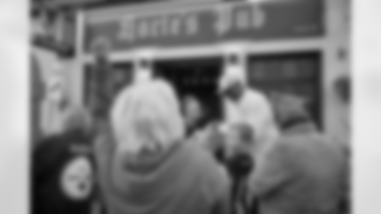 Pittsburgh Steelers legend Max Starks gives out Terrible Towels to locals on Tuesday, Sept. 23, 2025 in Gort, Ireland. (Brendan Moran / Pittsburgh Steelers)