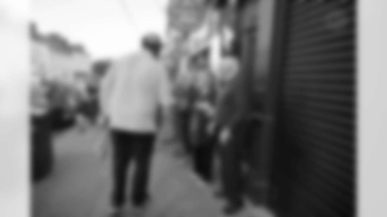 Pittsburgh Steelers legend Max Starks gives out Terrible Towels to locals on Tuesday, Sept. 23, 2025 in Gort, Ireland. (Brendan Moran / Pittsburgh Steelers)