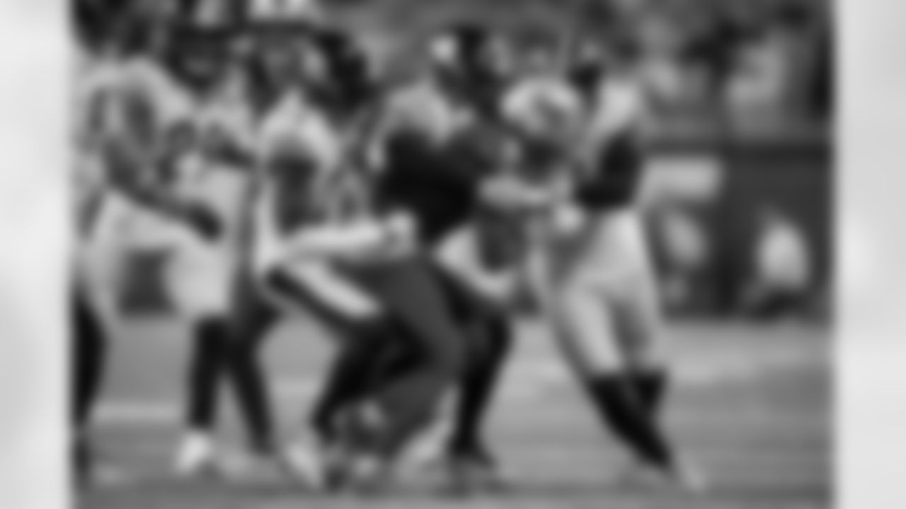 Pittsburgh Steelers defensive back Chuck Clark (21), cornerback Joey Porter Jr. (24), and linebacker Patrick Queen (6) make a tackle during a regular season game between the Pittsburgh Steelers and the Detroit Lions, Sunday, Dec. 21, 2025 in Detroit, MI. The Steelers defeated the Lions 29-24. (Karl Roser / Pittsburgh Steelers)