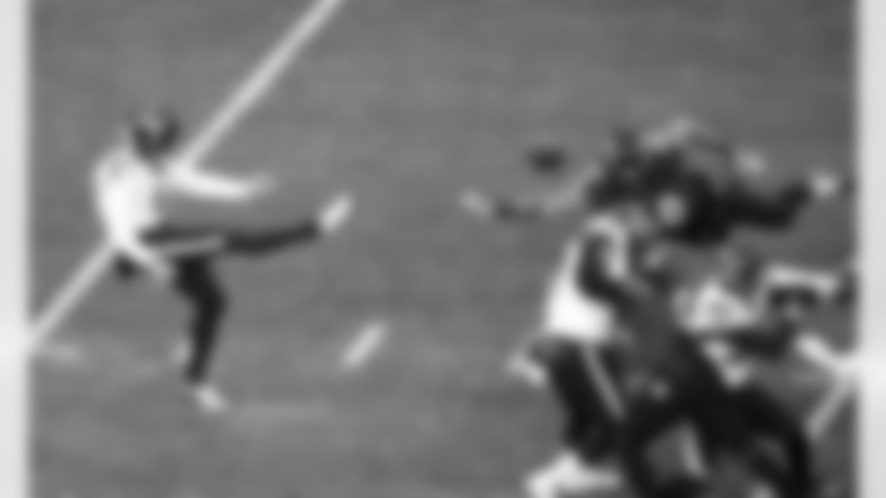 Houston Texans punter Cameron Johnston (11) punts during an NFL divisional round playoff football game against the Baltimore Ravens on Saturday, Jan. 20, 2024, in Baltimore. (AP Photo/Daniel Kucin Jr.)