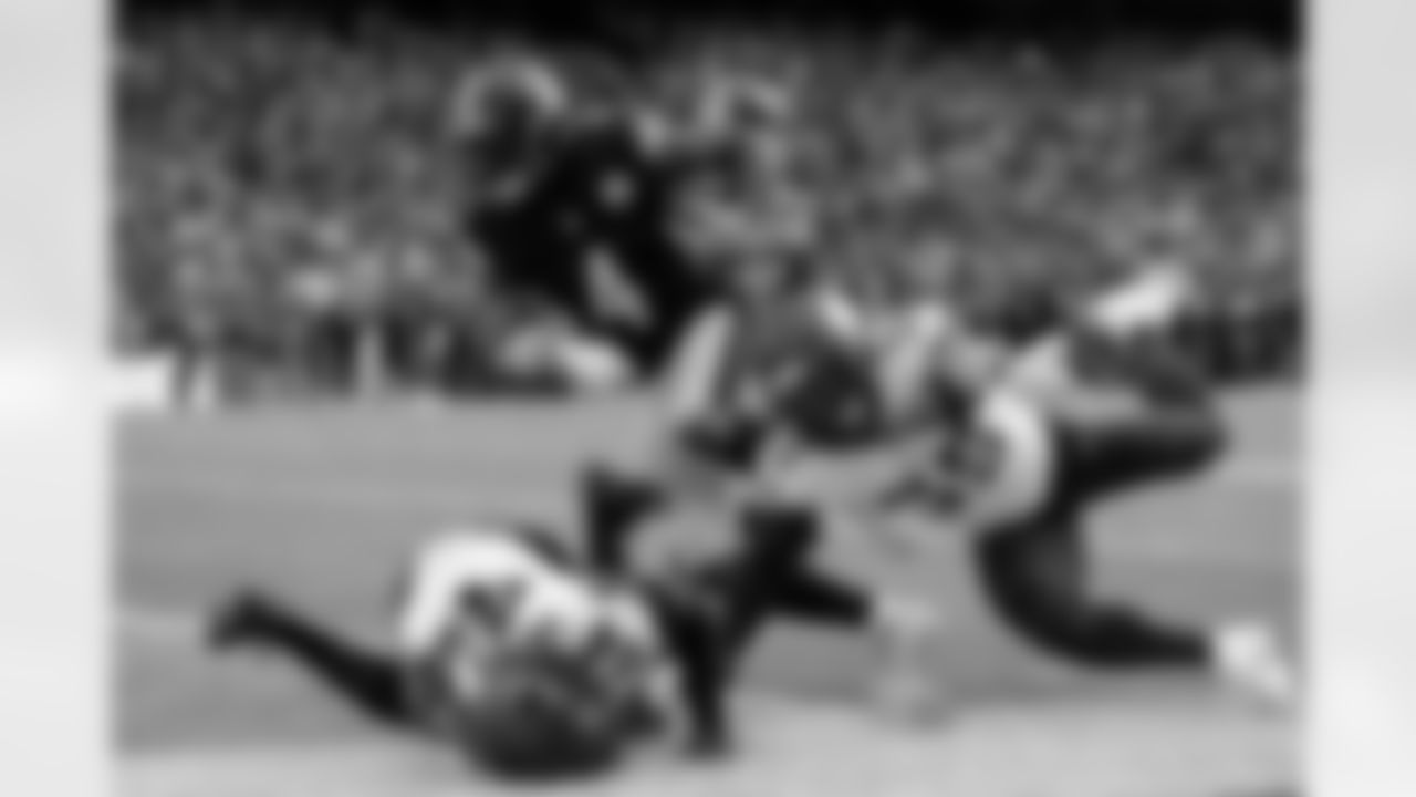 Pittsburgh Steelers wide receiver DK Metcalf (4) runs for a touchdown during a regular season game against the Minnesota Vikings, Sunday, Sept. 28, 2025 in Dublin, Ireland. The Steelers defeated the Vikings 24-21. One of the most electric moments from our game in Ireland was when Aaron Rodgers hit D.K. Metcalf on a slant route and Metcalf took it to the house. Initially, I was positioned in the corner of the end zone with my 400mm lens up to capture the action further down the field. When Mecalf turned on the jets, I quickly switched to my 70-200mm lens to capture him barreling over the Vikings defenders into the end zone. (Alysa Rubin/ Pittsburgh Steelers)

Model: Nikon Z9
Lens (mm): 100
ISO 250
Aperture: 3.5
Shutter: 1/2000