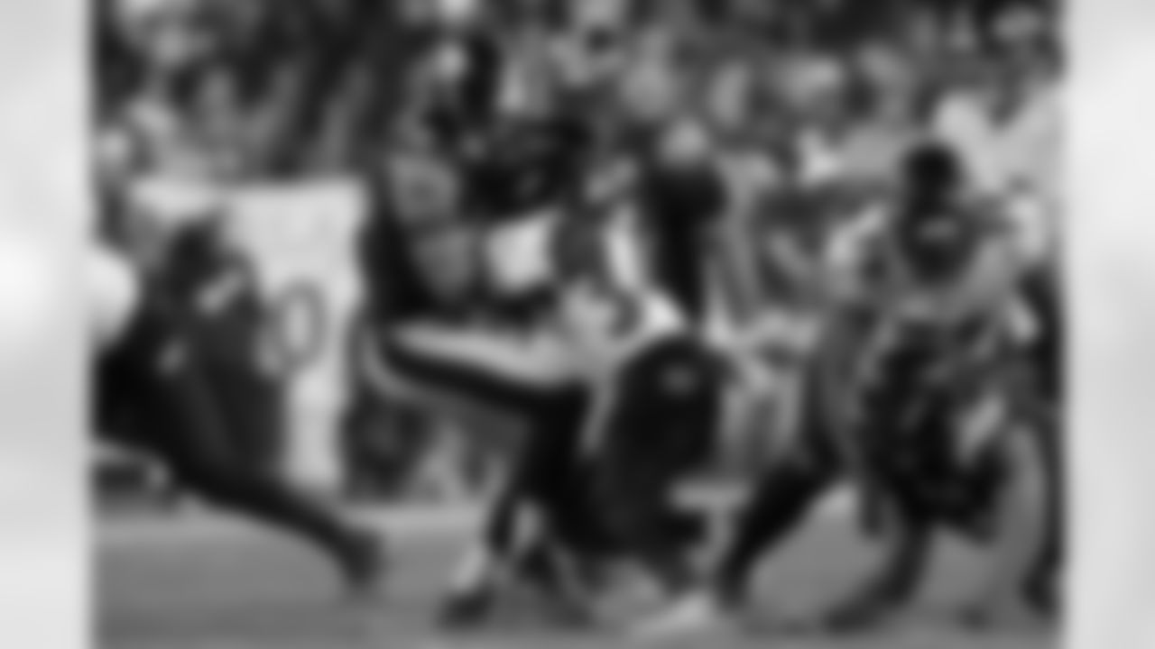 Pittsburgh Steelers linebacker Alex Highsmith (56) and Pittsburgh Steelers defensive tackle Cameron Heyward (97) tackle their opponent during a regular season game against the Baltimore Ravens, Sunday, Jan. 4, 2026 in Pittsburgh, PA. The Steelers defeated the Ravens 26-24. (Jared Wickerham / Pittsburgh Steelers)