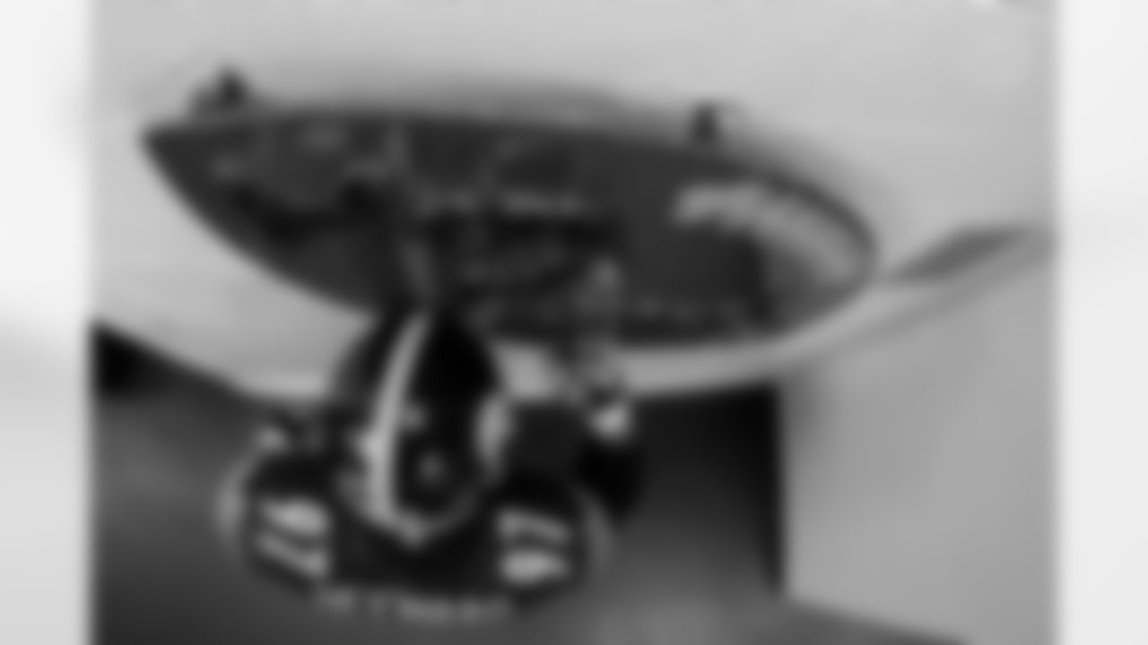 Pittsburgh Steelers defensive tackle Cameron Heyward (97) prior to a regular season game against the Baltimore Ravens, Sunday, Jan. 4, 2026 in Pittsburgh, PA. The Steelers defeated the Ravens 26-24. Every home game, a group of our players touch this "Men of Steel" sign outside of the locker room before walking out onto the field. Cam Heyward always takes a moment to himself, touching his helmet and hand to the sign before heading out. Last season, I ideated this concept and attempted to execute it in a few different ways. While I came away with a couple of images I liked, I wasn't completely satisfied. As I did last year, I rigged a remote camera onto the light fixture above the sign, ensuring it was pointed straight below. However, this year, I used a fisheye lens to ensure I was able to capture the entirety of both Heyward and the sign itself. I'm definitely more satisfied with this result.  (Alysa Rubin / Pittsburgh Steelers)

Model: Nikon D6
Lens (mm): 10.5
ISO 3200
Aperture: 6.3
Shutter: 1/500