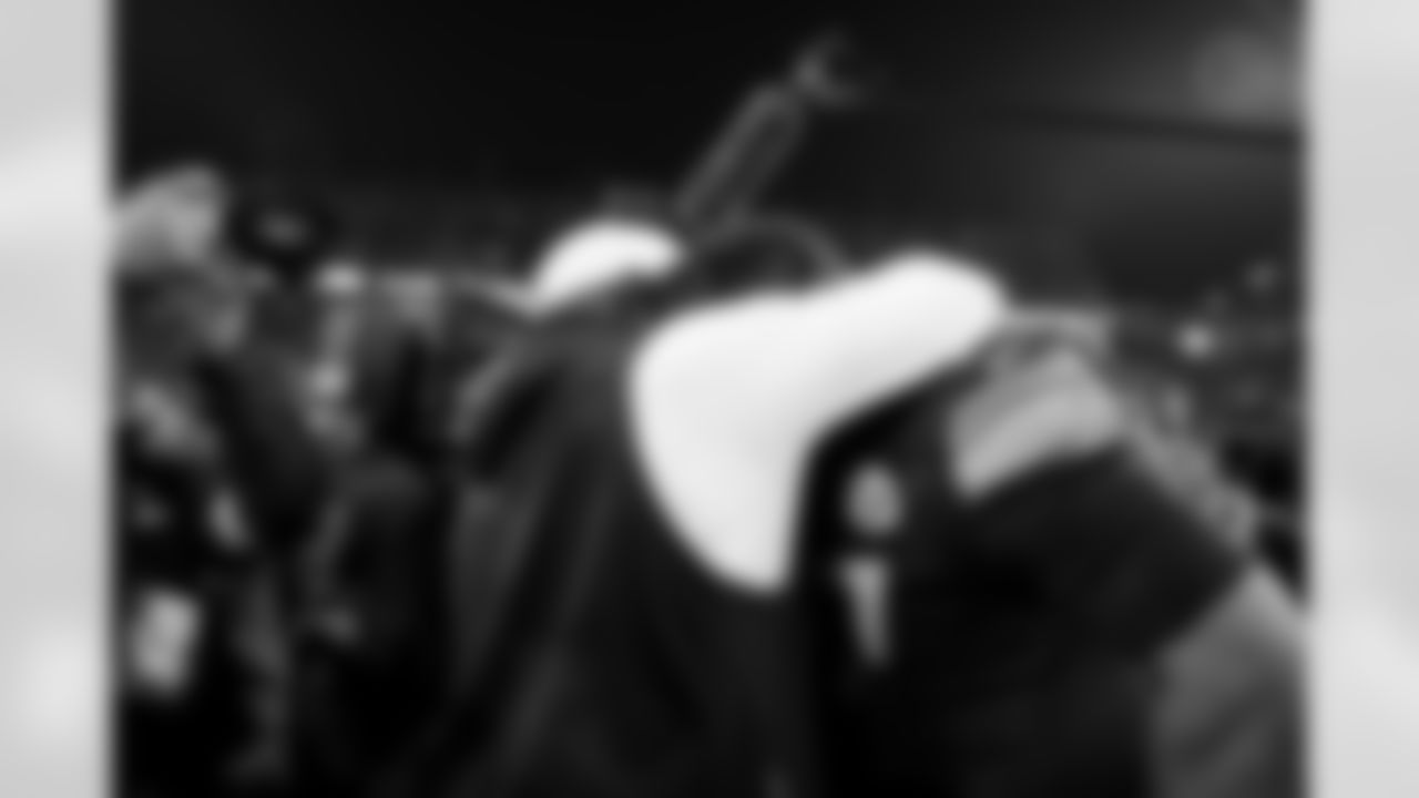 Pittsburgh Steelers head coach Mike Tomlin and Pittsburgh Steelers defensive tackle Cameron Heyward (97) following a regular season game between the Pittsburgh Steelers and the Baltimore Ravens, Sunday, Jan. 4, 2026 in Pittsburgh, PA. The Steelers defeated the Ravens 26-24. (Taylor Ollason / Pittsburgh Steelers)