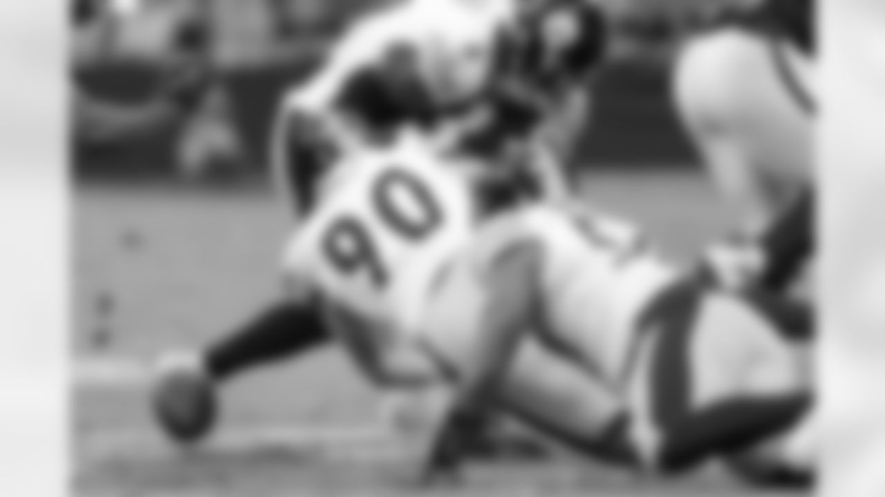 Pittsburgh Steelers linebacker T.J. Watt (90) forces a fumble during a regular season game between the Pittsburgh Steelers and the Las Vegas Raiders, Sunday, Oct. 13, 2024 in Las Vegas, NV. The Steelers defeated the Raiders 32-13. (Nick Smith / Pittsburgh Steelers)