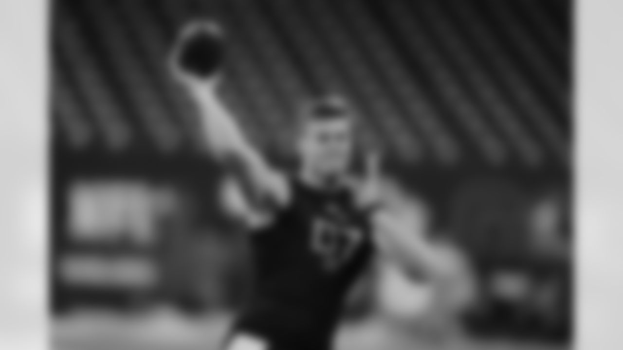 Ohio State quarterback Will Howard runs a drill at the NFL football scouting combine in Indianapolis, Saturday, March 1, 2025. (AP Photo/Michael Conroy)