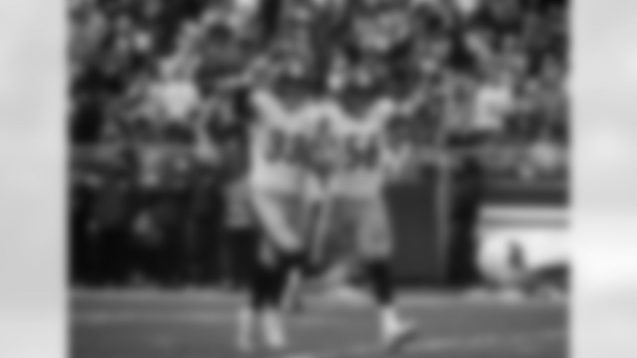 Pittsburgh Steelers linebacker Jack Sawyer (33) and Pittsburgh Steelers linebacker Alex Highsmith (56) celebrate during a regular season game between the Pittsburgh Steelers and the Cleveland Browns, Sunday, Dec. 28, 2025 in Cleveland, OH. The Browns beat the Steelers 13-6. (Taylor Ollason / Pittsburgh Steelers)