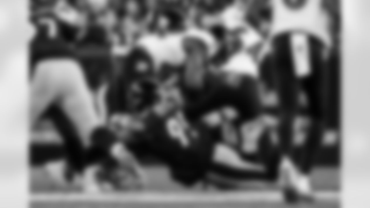 Pittsburgh Steelers defensive tackle Keeanu Benton (95) and Pittsburgh Steelers linebacker Payton Wilson (41) tackle their opponent during a regular season game against the Baltimore Ravens, Sunday, Jan. 4, 2026 in Pittsburgh, PA. The Steelers defeated the Ravens 26-24. (Alysa Rubin / Pittsburgh Steelers)