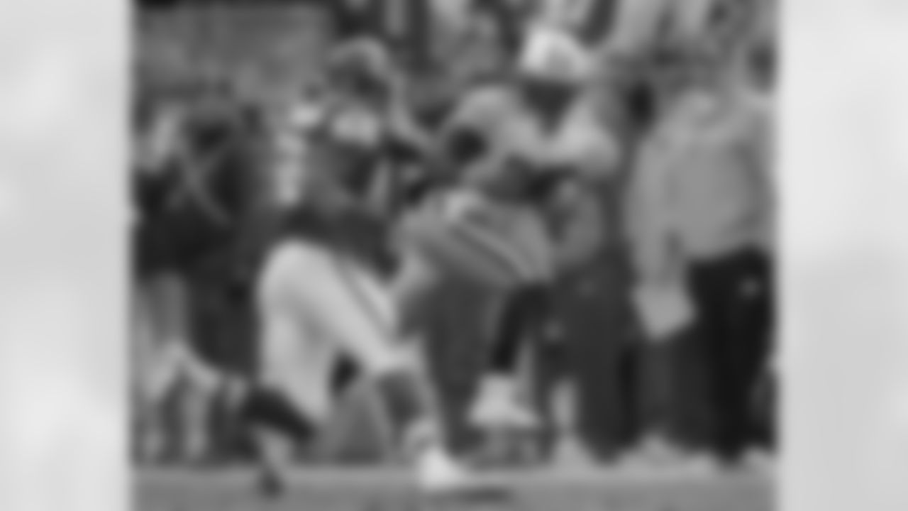 Tennessee Titans running back Chris Johnson (28) is chased by Kansas City Chiefs linebacker Derrick Johnson (56) during the second quarter of an NFL football game Sunday, Dec. 26, 2010 in Kansas City, Mo. (AP Photo/Charlie Riedel)