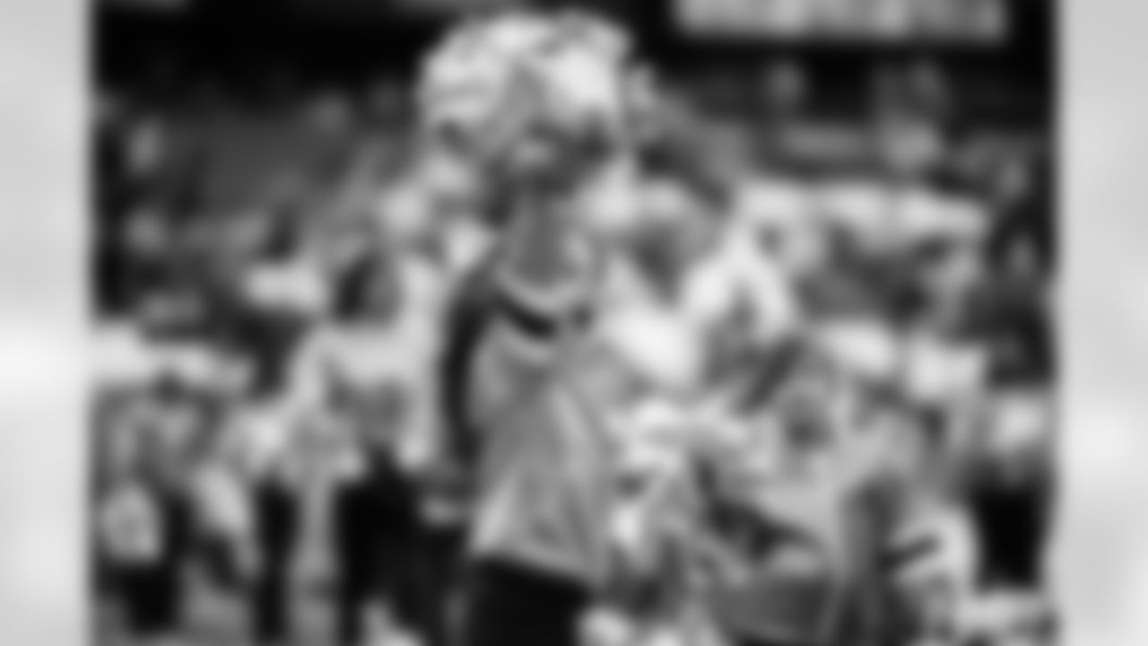 Tennessee Titans Cheerleaders performing with their Jr. Titans Cheer team on the field before the game between the Tennessee Titans and the Los Angeles Chargers at Nissan Stadium on November 02, 2025 in Nashville, TN. Photo By Kaitlyn Hungerford/Tennessee Titans