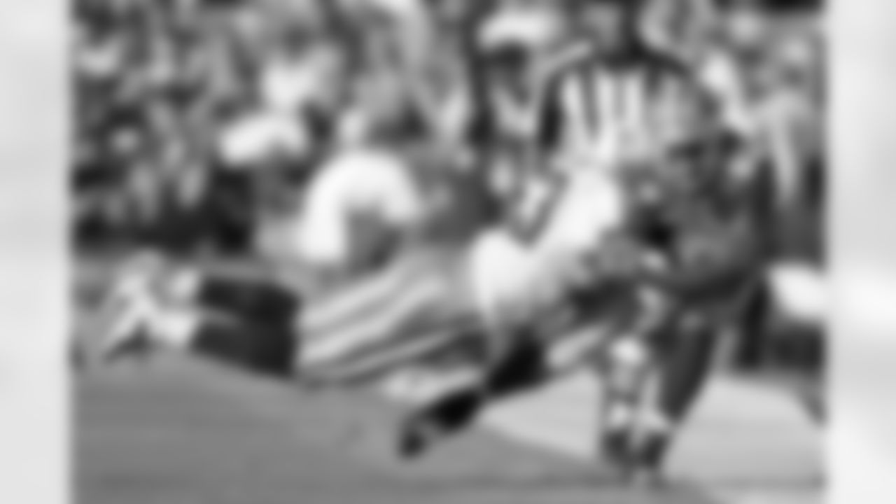 San Francisco 49ers tight end Vernon Davis (85) is knocked down by Tennessee Titans linebacker Kieth Bulluck (53) during an NFL game, Nov. 8, 2009 in San Francisco. The Titans won the game, 34-27. (AP Photo/Greg Trott)