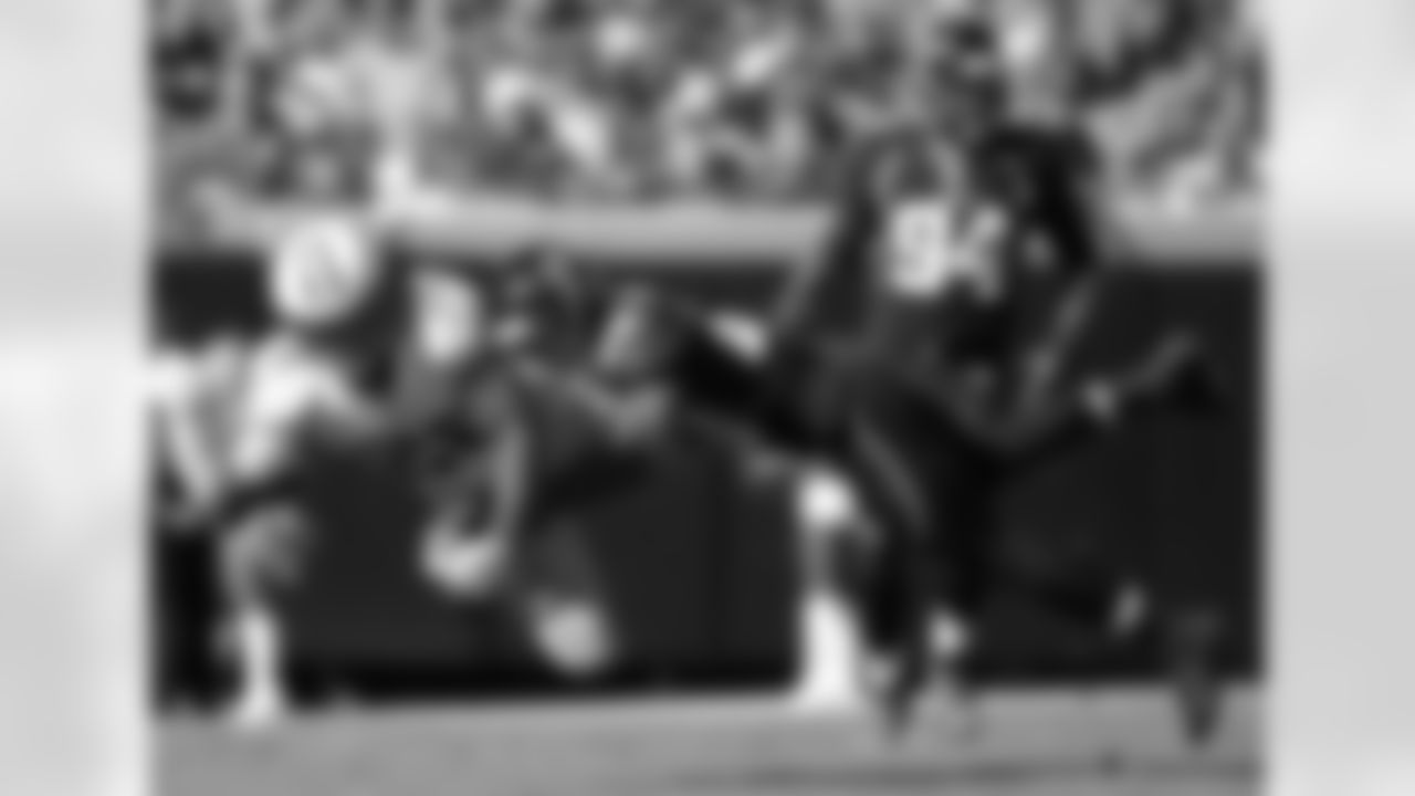 Tennessee Titans running back Chris Johnson (28) is brought down by Jacksonville Jaguars cornerback Mike Harris (20) after making an 11-yard reception during the first half of an NFL football game in Jacksonville, Fla., Sunday, Nov. 25, 2012. The Jaguars won 24-19.(AP Photo/Phelan M. Ebenhack)