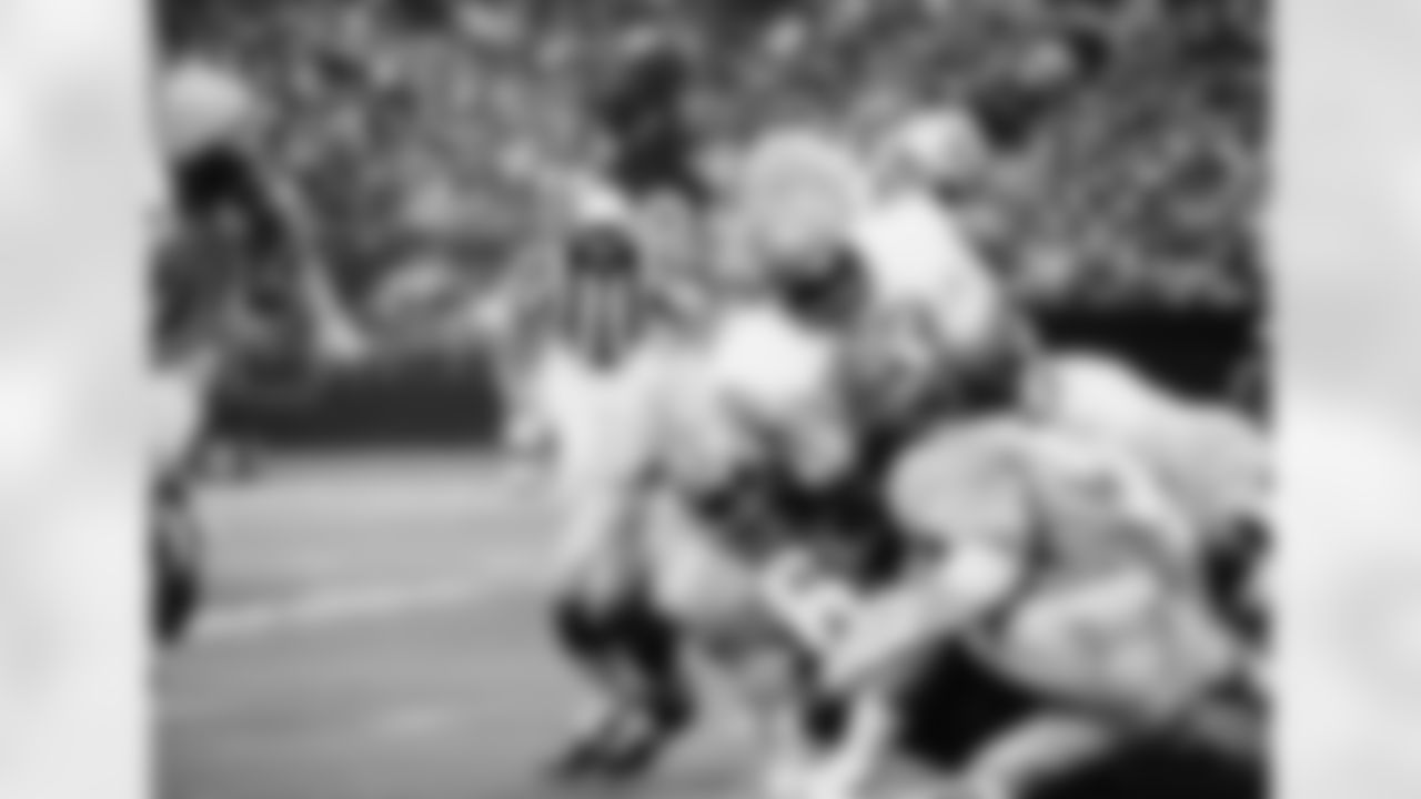 Kansas City Chiefs running back Wendell Hayes (38) as he crashes over his left tackle slot to pick up two yards before he was hit by Houston Oilers Elvin Bethea (65) and met by Oilers Ron Pritchard (58) in the second quarter of the NFL game at the Houston Astrodome in Houston, on Sunday, afternoon, Sept. 27, 1971. Kansas City took the game 20-16. (AP Photo/EFK)