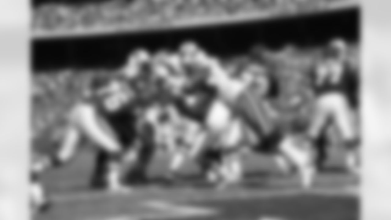 David Thornton #50 of the Tennessee Titans gets a hit on Brodie Croyle #12 of the Kansas City Chiefs at Arrowhead Stadium on October 19 in Kansas City, Missouri.  Tennessee defeated Kansas City 34-10.  (AP Photo/G. Newman Lowrance)