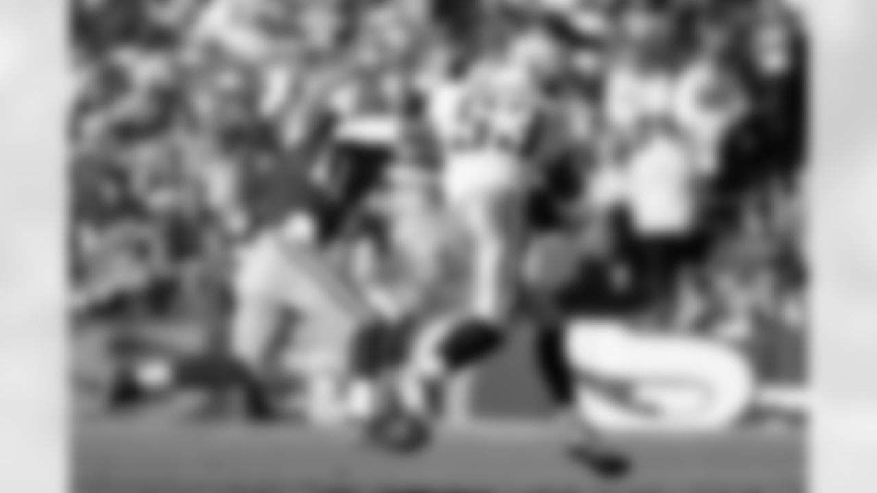 San Francisco 49ers quarterback Alex Smith (11) is sent flying by Tennessee Titans linbacker Keith Bulluck (53) after he picked up a fumble during an NFL game against, Nov. 8, 2009 in San Francisco. The Titans won the game, 34-27. (AP Photo/Greg Trott)