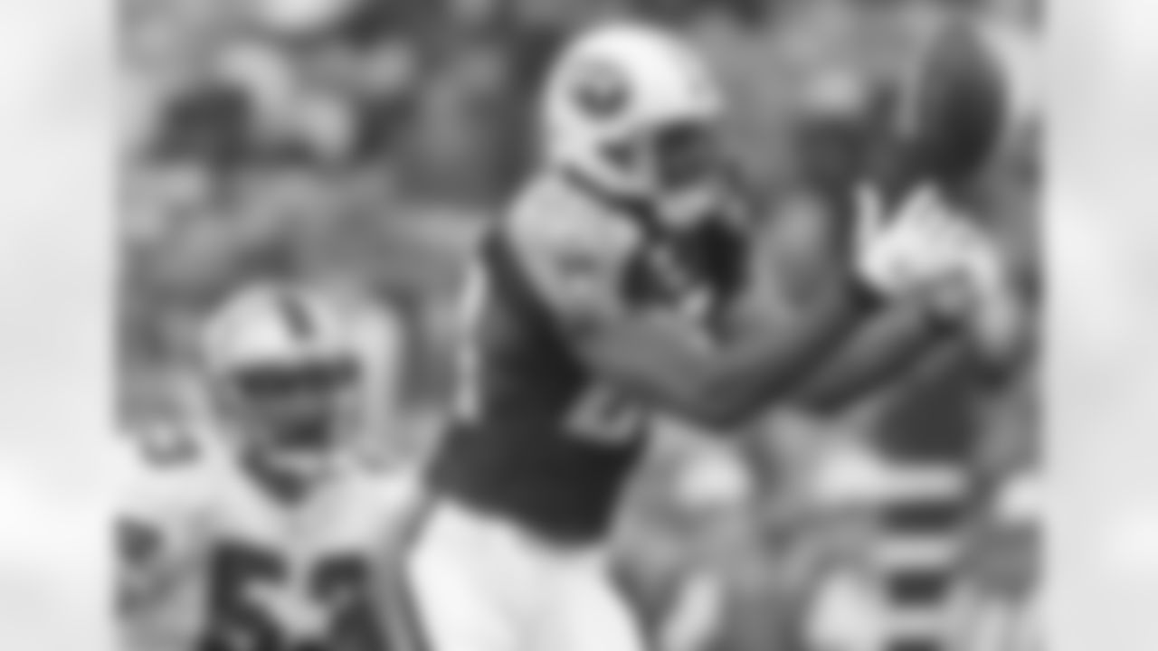 Tennessee Titans' Chris Brown eyes the ball before making the catch as San Francisco 49ers' Jeff Ulbrich covers during the first quarter Friday, Aug. 26, 2005, in San Francisco. (AP Photo/George Nikitin)