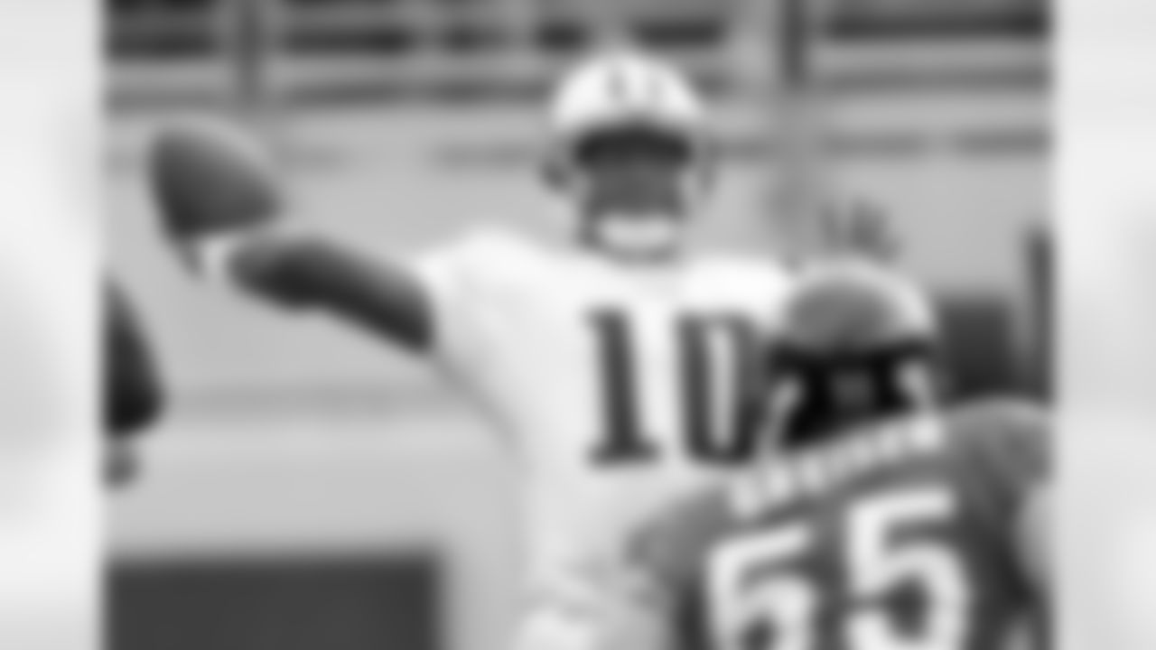 Tennessee Titans quarterback Vince Young drops back to pass as Jacksonville Jaguars defender Nick Greisen moves in to make a play during the first quarter of a National Football League game, Sunday, Nov. 5, 2006, in Jacksonville, Fla. (AP Photo/Phil Coale)