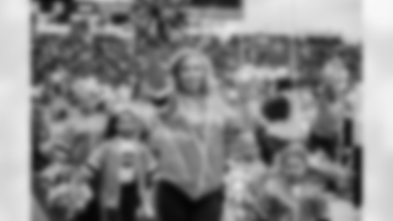Tennessee Titans Cheerleaders performing with their Jr. Titans Cheer team on the field before the game between the Tennessee Titans and the Los Angeles Chargers at Nissan Stadium on November 02, 2025 in Nashville, TN. Photo By Kaitlyn Hungerford/Tennessee Titans