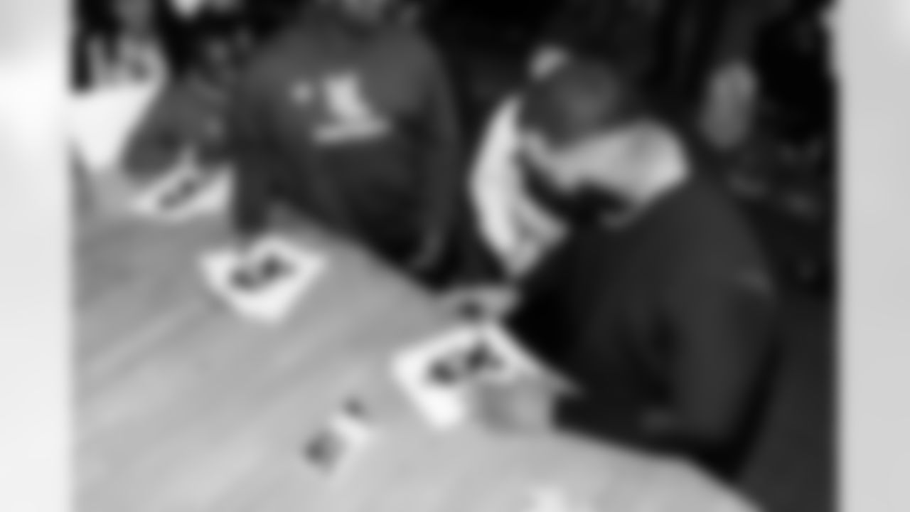 Defensive lineman Jeffery Simmons #98 of the Tennessee Titans speaks to Hunters Lane High School Girls Flag Football team after giving a donation on December 09, 2025 in Nashville, TN. Photo By Donald Page/Tennessee Titans