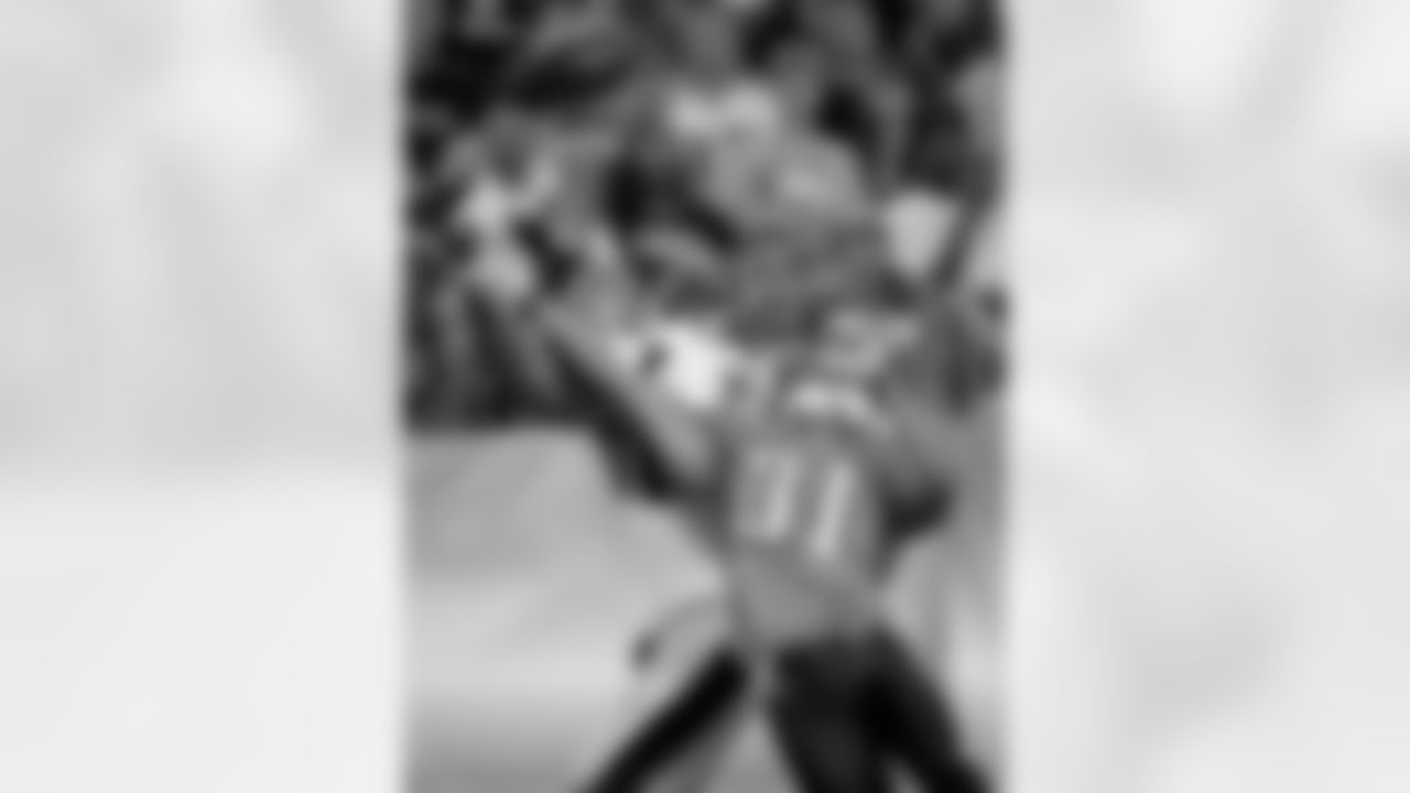 Tennessee Titans cornerback Cortland Finnegan (31) breaks up a pass to New Orleans Saints receiver Robert Meachem (17) during the first quarter of their NFL preseason football game at LP Field in Nashville, Tenn., Thursday, Sept. 2, 2010. (AP Photo/Dave Martin)