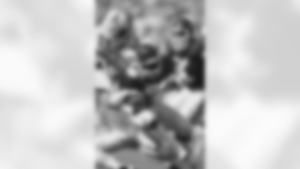 Kansas City Chiefs wide receiver Henry Marshall (89) is stopped by Houston Oilers cornerback Richard Johnson (23) during an NFL game in Kansas City on September 21, 1986.  The Chiefs defeated the Oilers 27-13. (AP Photo/Damian Strohmeyer)