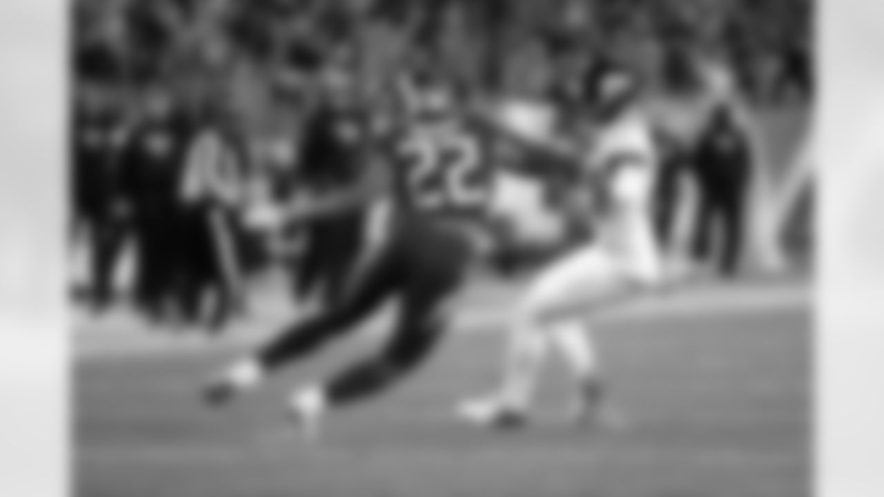 Tennessee Titans running back Derrick Henry (22) looks to run through Jacksonville Jaguars cornerback A.J. Bouye (21) as he hammers his way down field for a 99 yard touchdown good for a 13-2 second quarter Titans lead during the week 14 regular season NFL football game against the Jacksonville Jaguars on Thursday, Dec. 6, 2018 in Nashville, Tenn. The Titans won the game 30-9. (Paul Spinelli via AP)