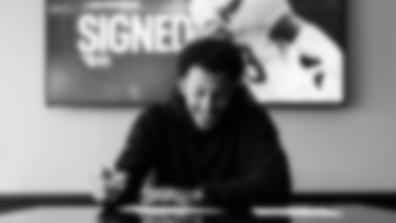 Elic Ayomanor signs his contract at the Ascension Saint Thomas Sports Park on May 8, 2025 in Nashville, TN. Photo By Donald Page/Tennessee Titans