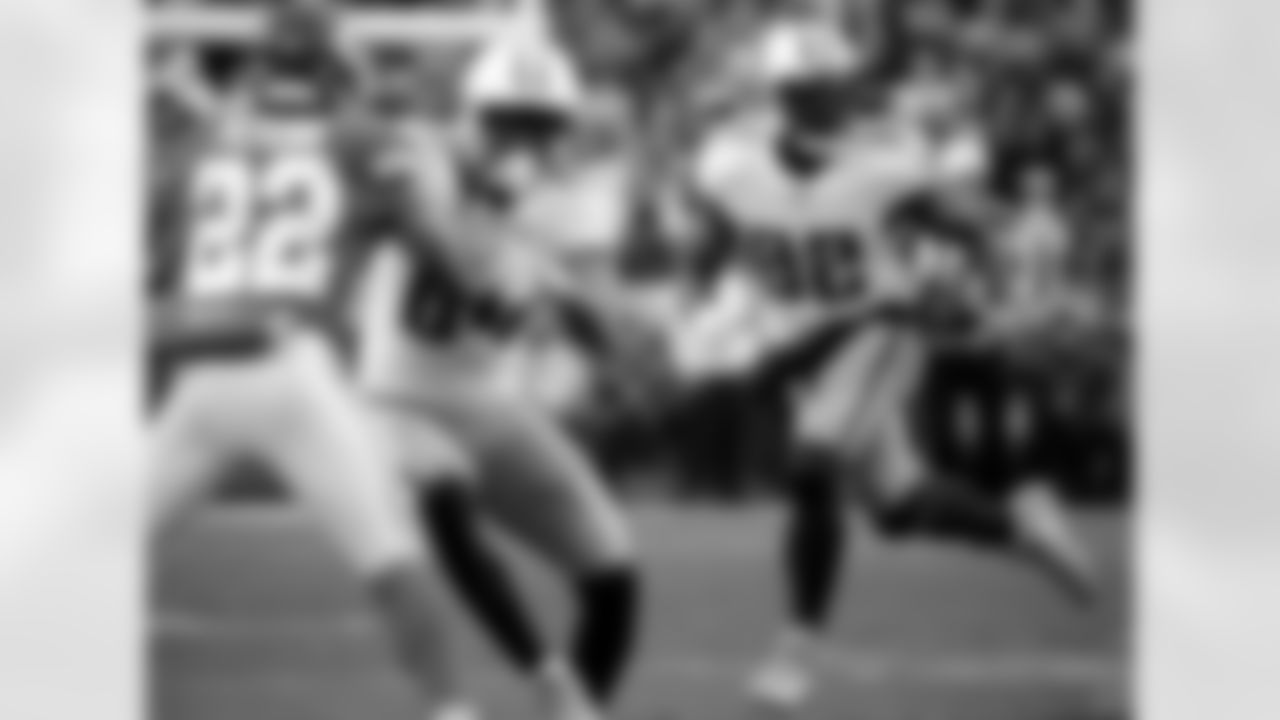 Tennessee Titans tight end Delanie Walker (82) carries the ball as wide receiver Corey Davis (84) blocks Kansas City Chiefs defensive back Marcus Peters (22) during the first half of an NFL wild-card playoff football game against Kansas City Chiefs in Kansas City, Mo., Saturday, Jan. 6, 2018. (AP Photo/Charlie Riedel)