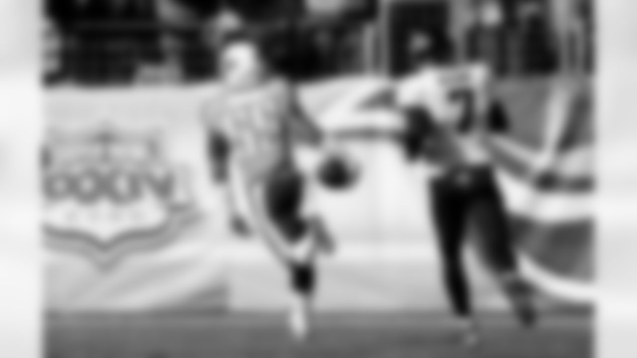 Tennessee Titans linebacker Zach Brown (55) leaves Jacksonville Jaguars quarterback Chad Henne (7) behind as Brown returns an intercepted pass 79 yards for a touchdown in the second quarter of an NFL football game on Sunday, Dec. 30, 2012, in Nashville, Tenn. (AP Photo/Joe Howell)