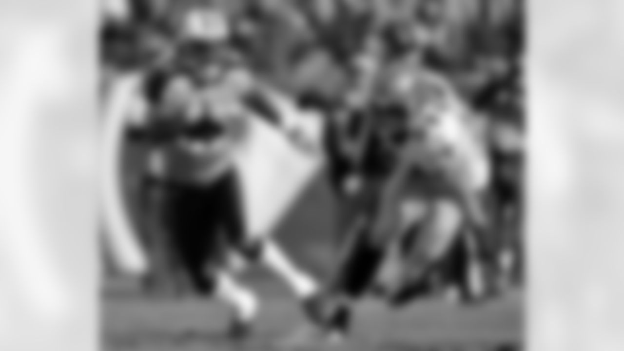 Tennessee Titans wide receiver Lavelle Hawkins, left, tries to evade New Orleans Saints linebacker Will Herring (54) in the second quarter of an NFL football game on Sunday, Dec. 11, 2011, in Nashville, Tenn. (AP Photo/Joe Howell)