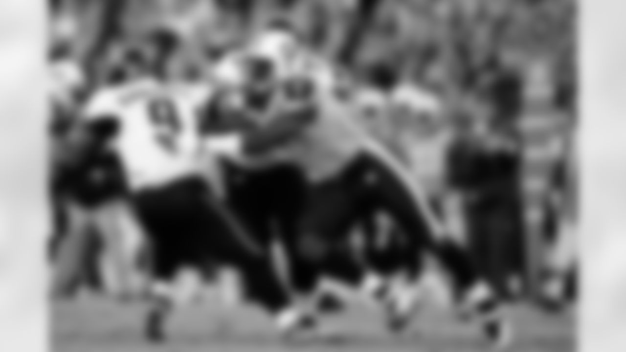 Quarterback David Garrard (9)  of the Jacksonville Jaguars is pressured by defensive end William Hayes (95) during an NFL football game on Sunday November 1, 2009 in Nashville, TN.  The Titans  defeated the Jaguars  30-13.  (AP Photo/Jim Mahoney)