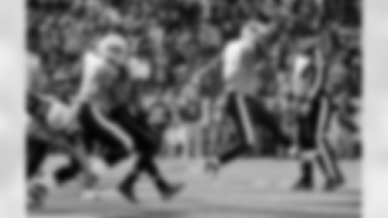 Tennessee Titans running back Jamie Harper (23) scores a touchdown on a 1-yard run as lineman Leroy Harris (64) blocks Jacksonville Jaguars free safety Dawan Landry (26) in the second quarter of an NFL football game on Saturday, Dec. 24, 2011, in Nashville, Tenn.  (AP Photo/Frederick Breedon)