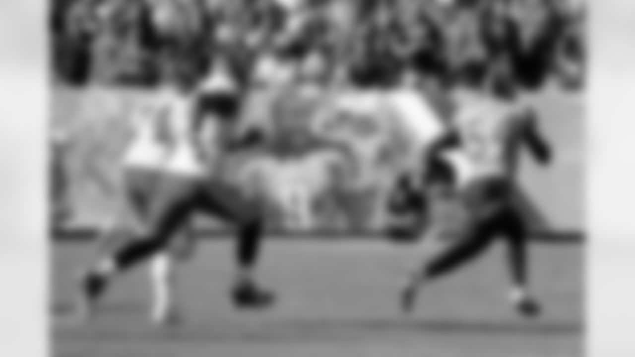 Tennessee Titans inside linebacker Rashaan Evans (54) runs back a fumble 53 yards for a touchdown as he is chased by Kansas City Chiefs offensive guard Martinas Rankin (74) and offensive tackle Cameron Erving (75) in the first half of an NFL football game Sunday, Nov. 10, 2019, in Nashville, Tenn. (AP Photo/Mark Zaleski)