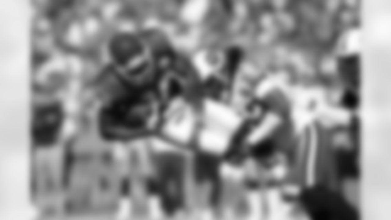 Dwayne Bowe #82 of the Kansas City Chiefs makes a reception as Michael Griffin #33 of the Tennessee Titans makes the tackle at Arrowhead Stadium on October 19 in Kansas City, Missouri.  Tennessee defeated Kansas City 34-10.  (AP Photo/G. Newman Lowrance)