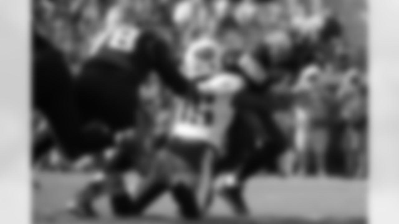 Jacksonville Jaguars quarterback Chad Henne (7) is sacked by Tennessee Titans defensive end Kamerion Wimbley (95) after getting past tackle Cameron Bradfield (78) during the first half of an NFL football game in Jacksonville, Fla., Sunday, Dec. 22, 2013.(AP Photo/Phelan M. Ebenhack)