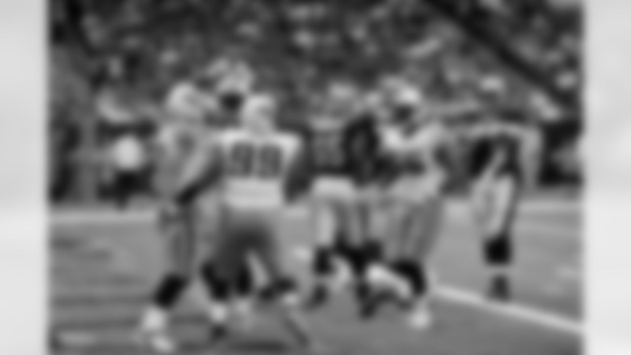 Tennessee Titans celebrate their saftey of New Orleans Saints quarterback Sean Canfield during the first quarter of an NFL preseason football game at the Louisiana Superdome in New Orleans, Thursday, Sept. 1, 2011. (AP Photo/Bill Feig)