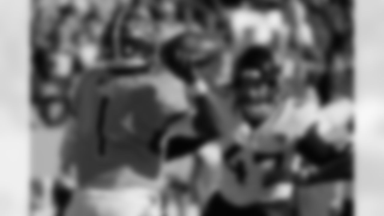 Tennessee Titans quarterback Cam Ward (1) throws a pass as Jacksonville Jaguars linebacker Dennis Gardeck (47) pressures him during the first half of an NFL football game Sunday, Nov. 30, 2025, in Nashville, Tenn. (AP Photo/George Walker IV)