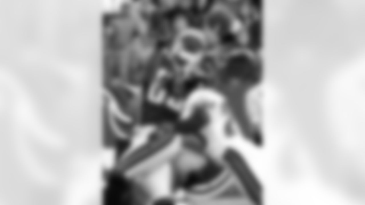 Tennessee Titans wide receiver Derrick Mason catches a touchdown pass in the fourth quarter as he is defended by Jacksonville Jaguars cornerback Fernando Bryant, right, Sunday, Nov. 4, 2001, in Nashville, Tenn. The Titans won 28-24. (AP Photo/Wade Payne)