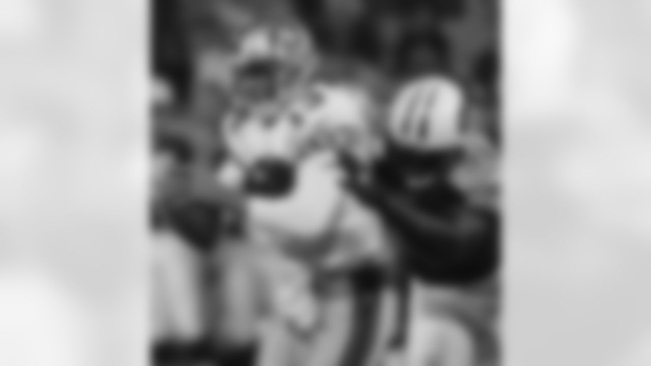 San Francisco 49ers quarterback Tim Rattay gets sacked by Tennessee Titans' Antwan Odom during the second quarter Friday, Aug. 26, 2005, in San Francisco. (AP Photo/George Nikitin)