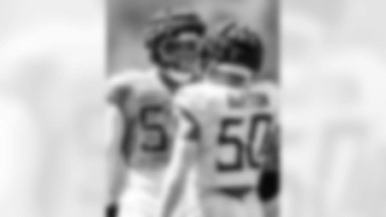 Tackle JC Latham #55 of the Tennessee Titans and Linebacker Cody Barton #50 of the Tennessee Titans during training camp practice at the Ascension Saint Thomas Sports Park on August 18, 2025 in Nashville, TN. Photo By Beau Brune/Tennessee Titans